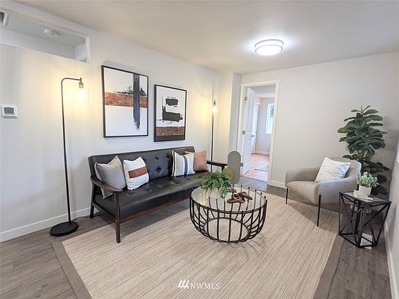 Luxury vinyl plank in main living areas to compliment the wood floors throughout bedrooms.