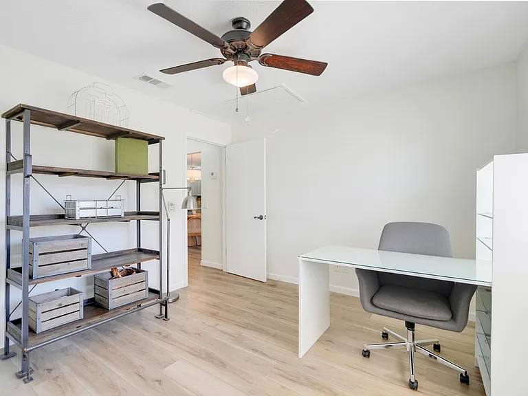 Guest bedroom with built-in closet_currently used as an office, offering flexible space to suit your needs.