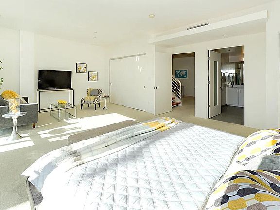 Spacious oversized master bedroom with wall to wall windows, and en suite master bath