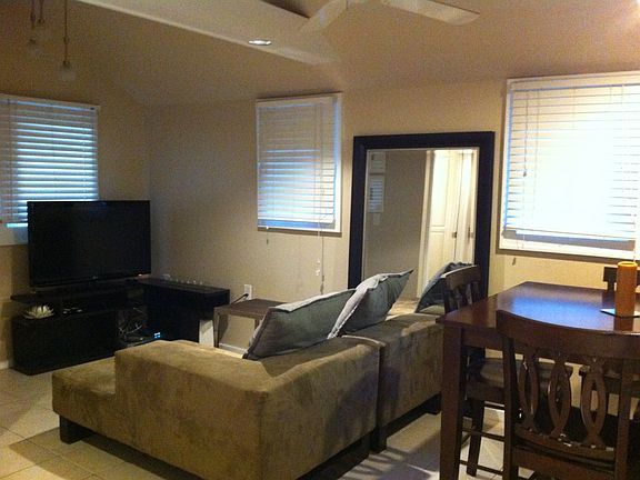 Kitchen/liviing room with vaulted ceiling and wood beams