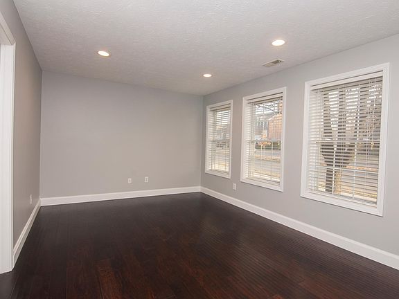 New Jasper hardwood floors with adjustable can lighting throughout house.