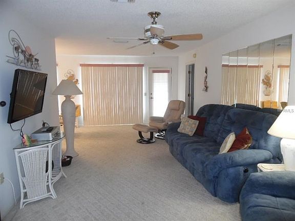 Very light & Bright Living Room with a door to the open patio in the rear