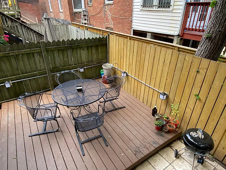 View of patio from stairway leading to apartment.