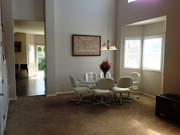 The dining area is has a bay window overlooking the back yard and play area.