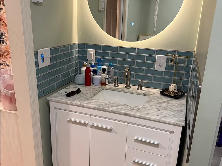 There is a walk in shower to the right.