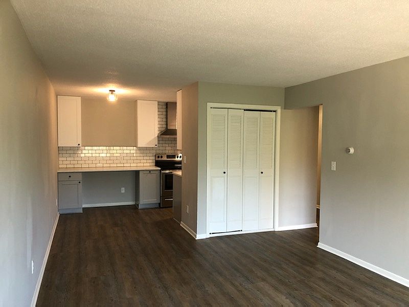 Living room looking at kitchen and dining area