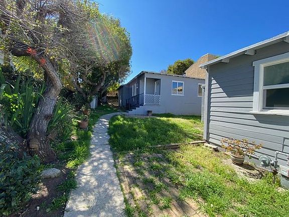 Front gate entrance. Garage and storage are to the right.