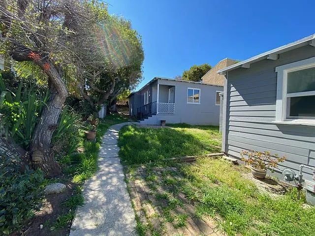 Front gate entrance. Garage and storage are to the right.