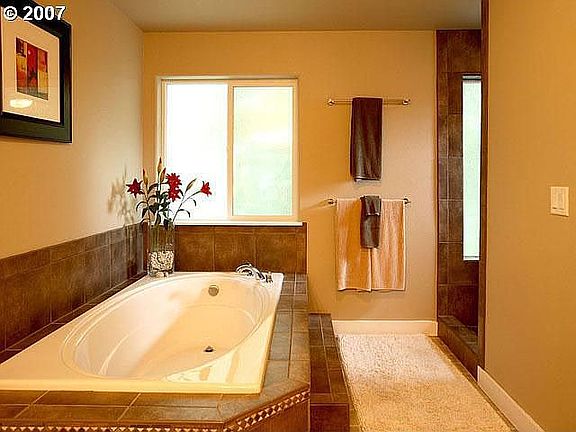Master bath with 6 foot soaker tub and tiled, walk-in shower