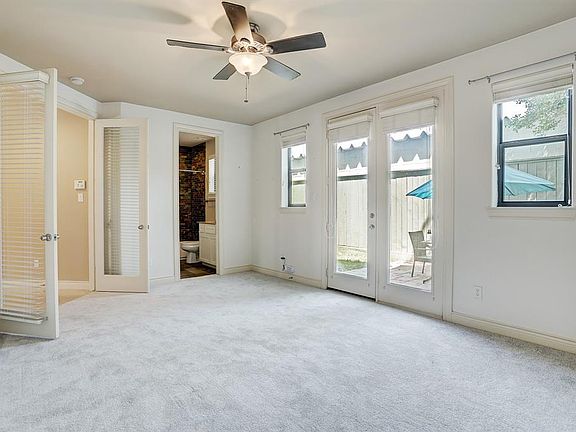 A view of the bedroom and the en-suite bathroom.