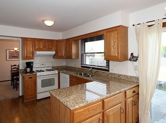 Kitchen: marble counters, hardwood floors