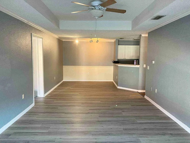 The living room and dinner room combo with new installed Vinyl plank floor