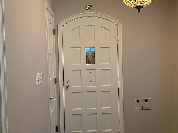 Front door and coat closet