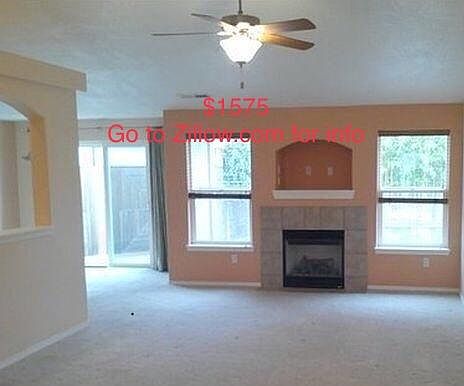 Living room w/vaulted ceilings & gas fireplace 