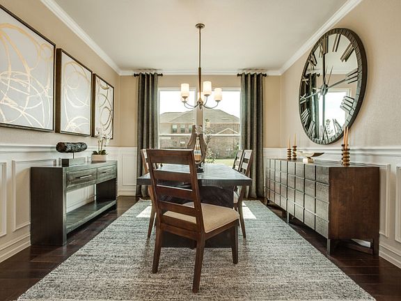 Model Representation - Formal dining area just off the foyer with space to seat the whole family