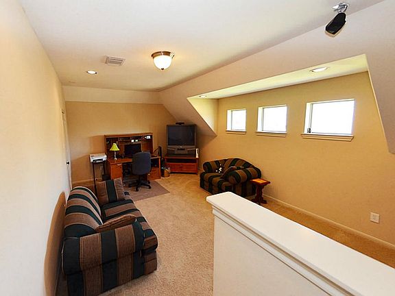 Media room -  sits over the garage, so the noise from adventure movies won't wake up the rest of the house!