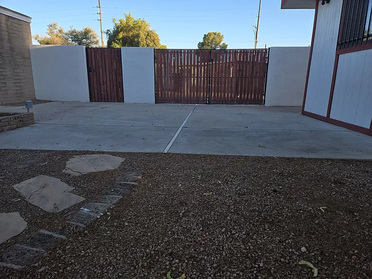 Private entrance and secure parking. Your yard has a BBQ, laundry, and trees. Wow!