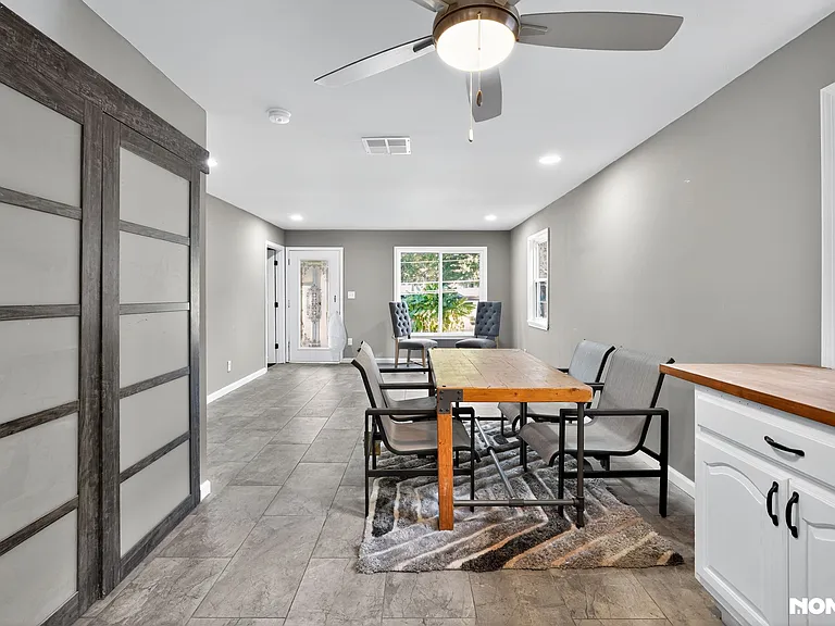 KITCHEN/DINING AREA WITH ENCLOSED CABINETS