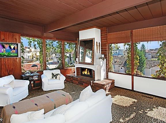 Great room with high beamed ceilings and fireplace