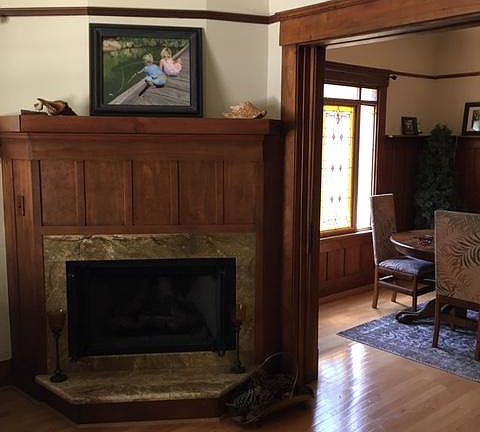 Living room fireplace through to Dining room