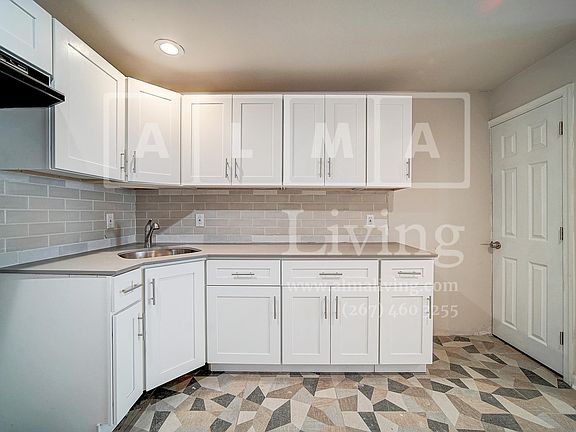 Kitchen includes a stove and fridge
