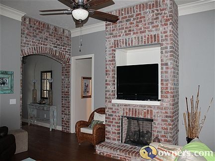 Living Room with Brick Fireplace