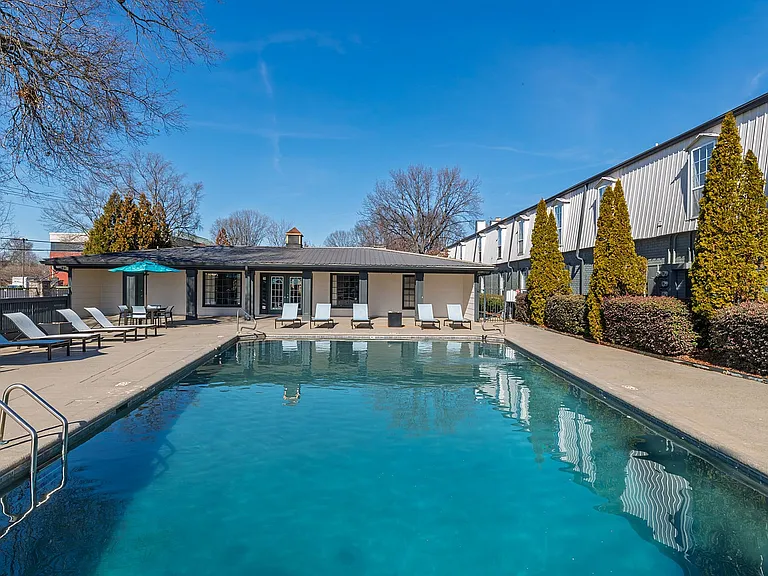 Relax and unwind at this tranquil poolside oasis, perfect for sunny afternoons.