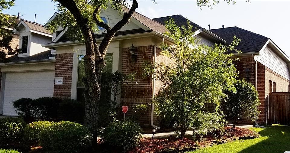 Front view w gorgeous landscaping