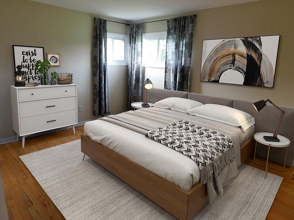 Spacious Master Bedroom with refinished hardwood floors, freshly painted, double closet.