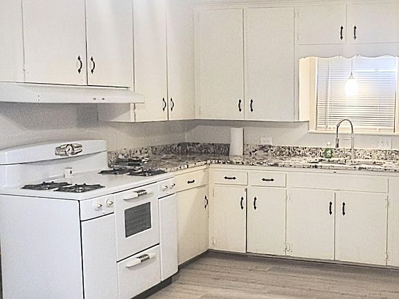 Light and bright kitchen with the perfect blend of vintage charm and modern convenience! Imagine yourself cooking your favorite meals on this SWEET porcelain 1950's gas range!! It will be your favorite old/new appliance!! All appliances are INCLUDED!!