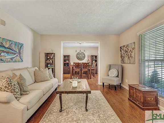 Formal living, and separate dining room. Look at those beautiful floors!