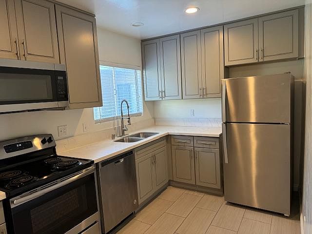 Large Kitchen with Stainless Applicances and Double Stainless Sink; Designer Gray Cabinetry