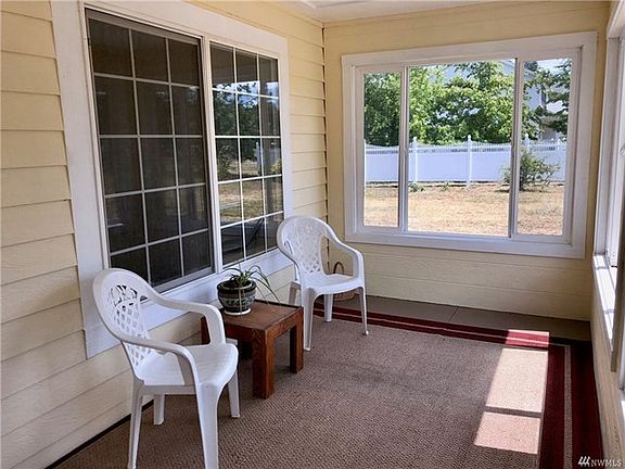 Private covered front porch that is great for having morning coffee or rest in a relaxing sun room!
