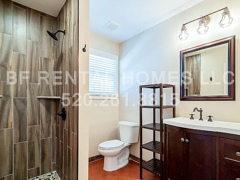 Bathroom #3 with custom tiled shower and modern vanity