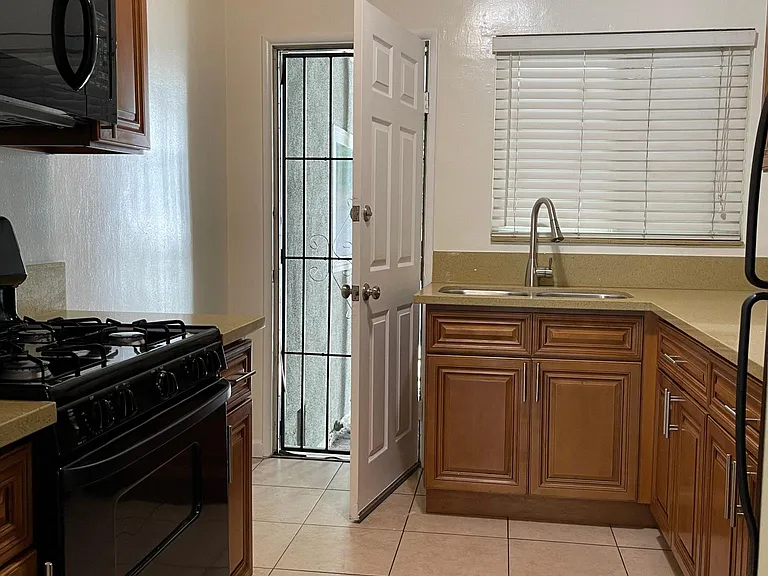 Newer cabinets with lots of storage and exterior door to pool and laundry
