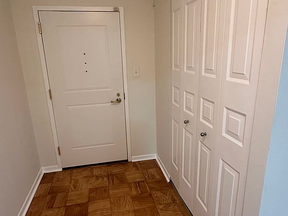 The entrance welcomes you with a spacious closet_perfect for coats, shoes, and everyday storage_leading into a bright and inviting living room with access to a charming balcony.