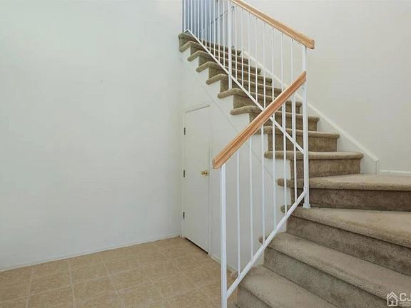 Entry way with spacious shoe closet and coat closet