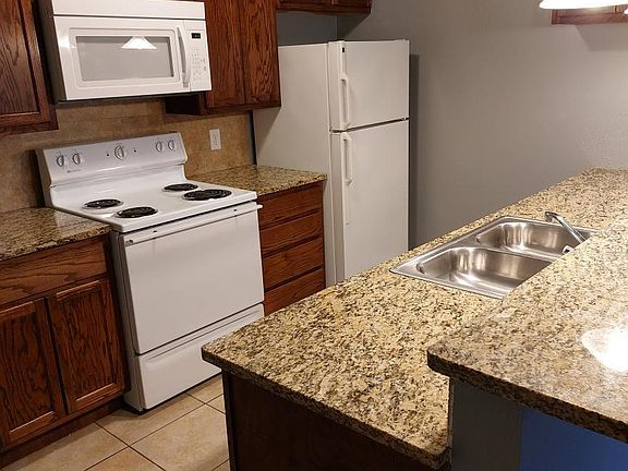 Kitchen comes with stove, refrigerator, microwave and dishwasher.