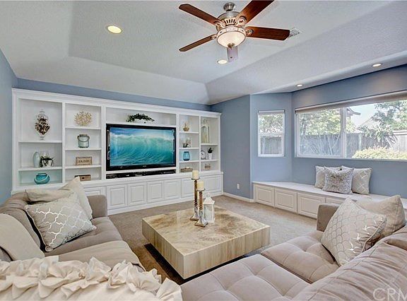 Beautiful Family Room off the the kitchen offers a built in Entertainment center, recessed lights, c