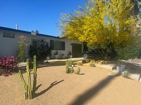 Front of the house, drive way and one car garage