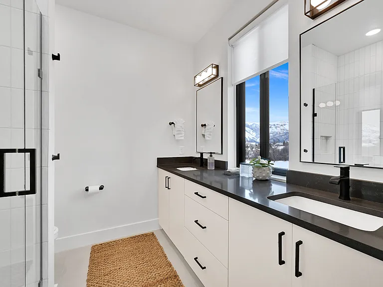 Master bathroom with his and hers sinks and walk in shower