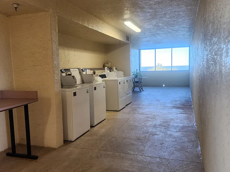 laundry area steps from unit