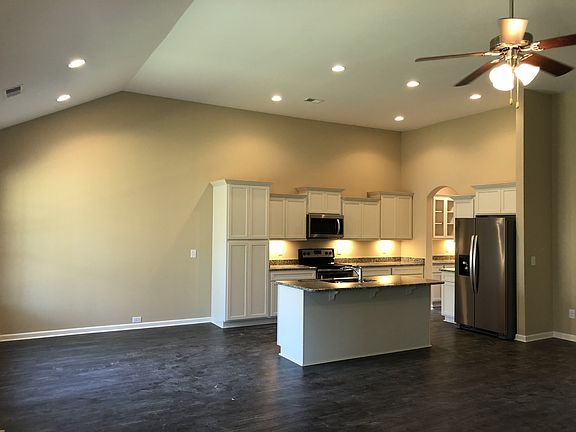 File photo of the great room into the kitchen breakfast area.