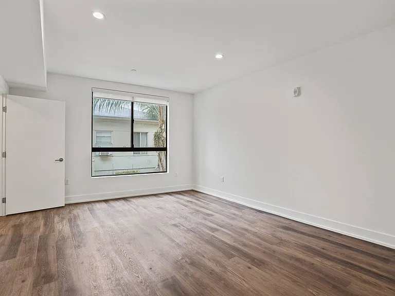 Bedroom with Recessed Lighting, Vinyl Flooring, and Windows