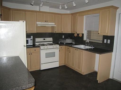 Kitchen, dishwasher was put in after photo taken
