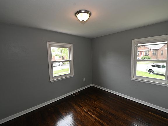BEDROOM 1 - Corner Windows and Beautiful Hardwood Floors!