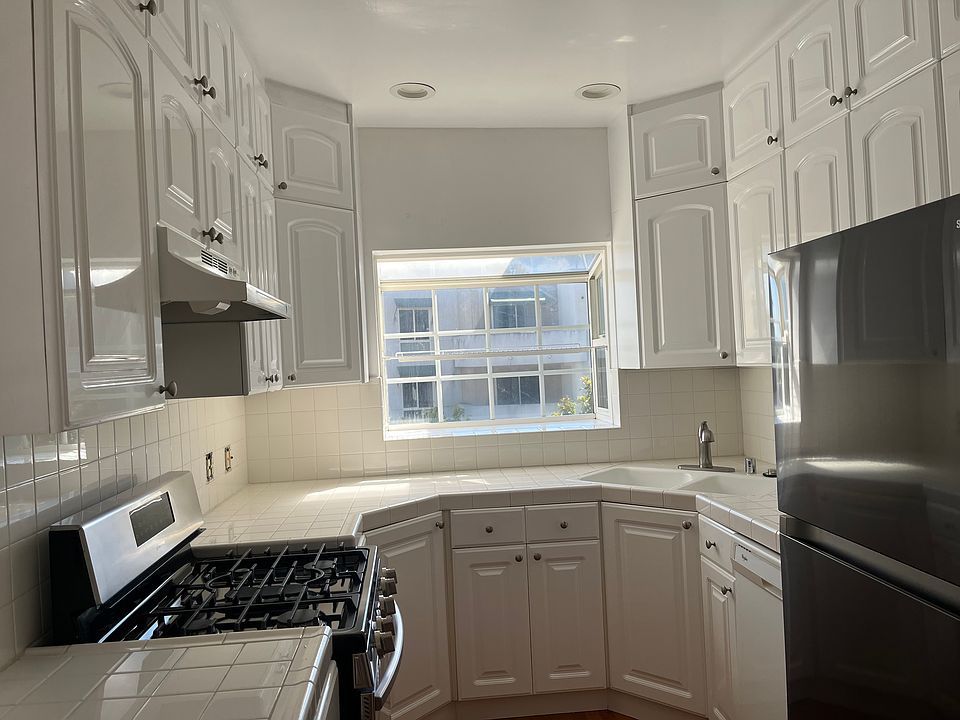 KITCHEN: Stainless Steel Refrigerator, Stove & Dishwasher. 2 Large Garden Windows. All New Plumbing Fixtures and Recessed Lighting