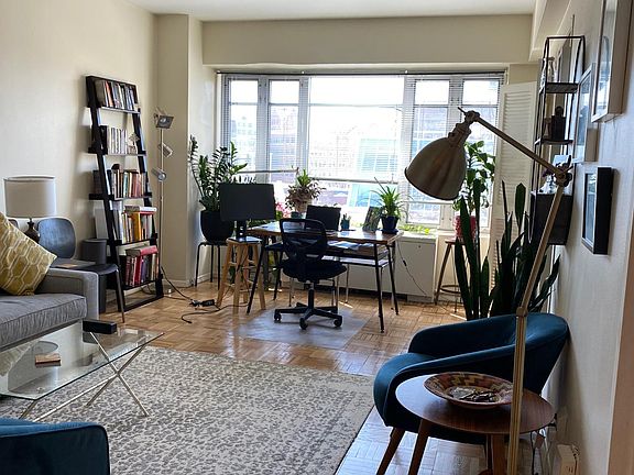 View of Living Room from Foyer to South Facing Windows over Mass Ave.