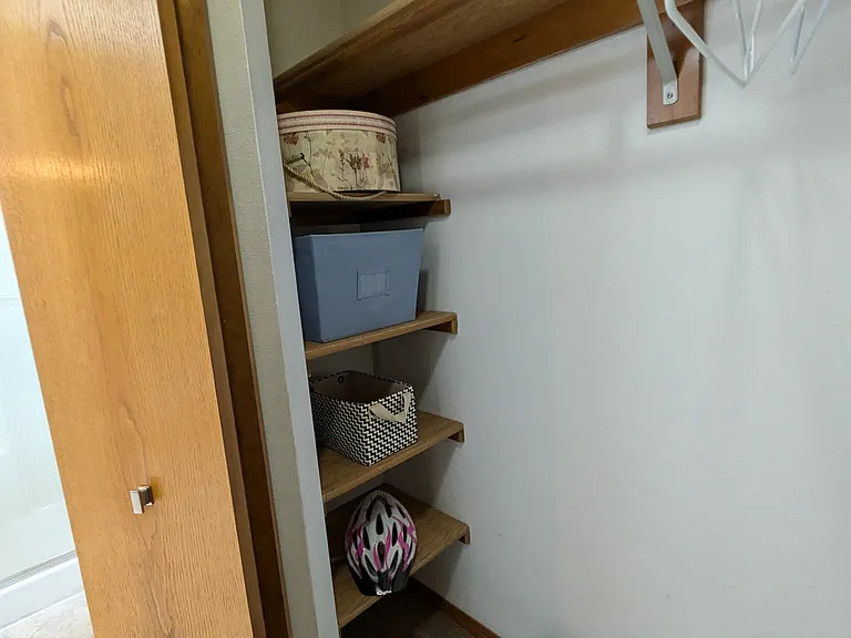 Primary bedroom walk-in closet - Built in Shelving