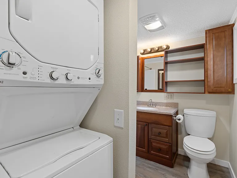 In-unit stacked washer and dryer